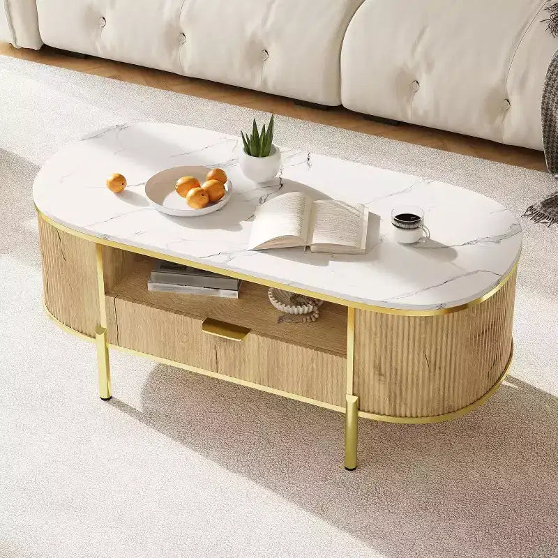 Table basse cannelée moderne COZONY avec tiroir, dessus ovale en faux marbre de 48" et pieds dorés pour salon