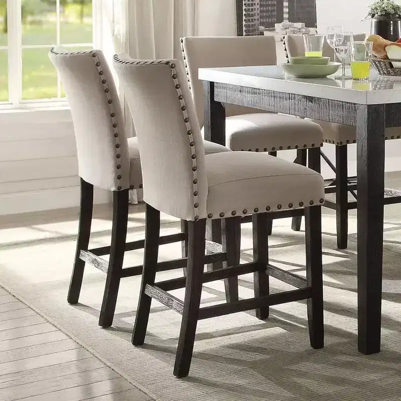 Lot de 2 tabourets de bar Nolan 63,5 cm en lin beige et finition chêne foncé vieilli - Acme Furniture : assise rembourrée, clous décoratifs, structure en métal