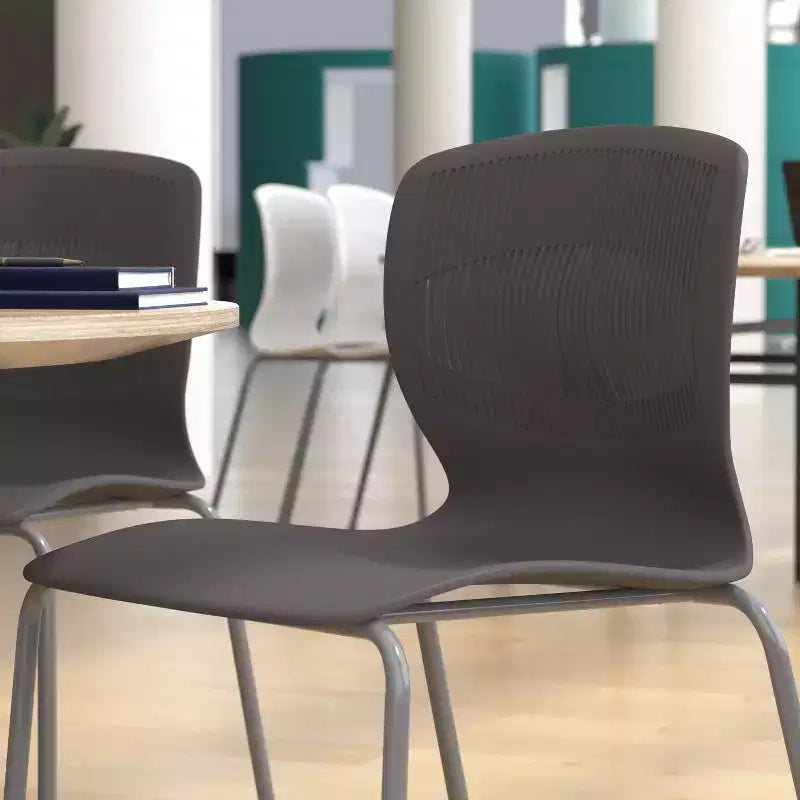 Chaise empilable ergonomique en polypropylène Emma and Oliver, capacité 350 kg, avec support lombaire et structure en acier