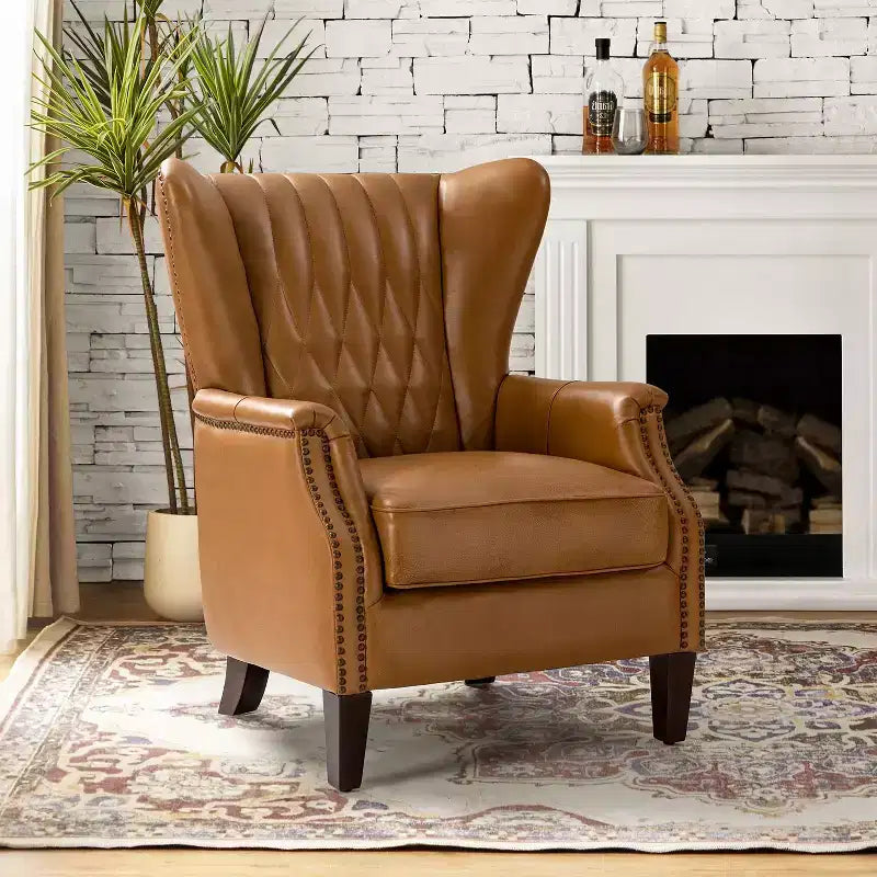 Fauteuil en cuir véritable Valerius avec garniture cloutée et pieds en bois massif | HULALA HOME