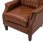 Fauteuil en cuir véritable Valerius avec garniture cloutée et pieds en bois massif | HULALA HOME