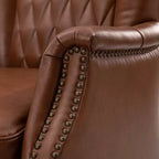 Fauteuil en cuir véritable Valerius avec garniture cloutée et pieds en bois massif | HULALA HOME