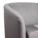 Fauteuil club capitonné Emma and Oliver de style tonneau avec base pivotante à 360 degrés revêtue de vinyle et accoudoirs inclinés