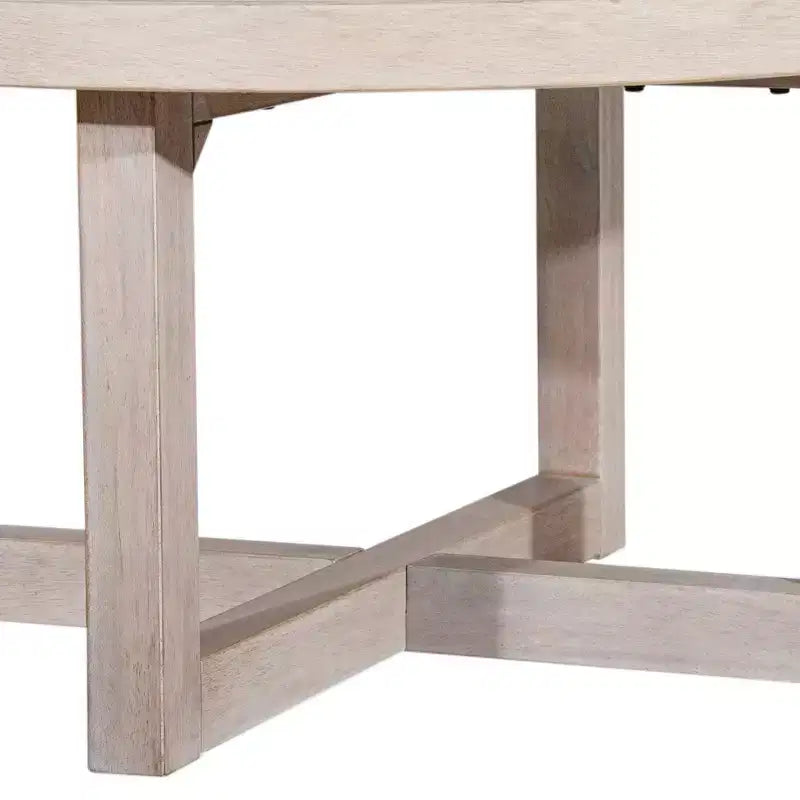 Table basse ronde East at Main 38 avec piétement entrecroisé