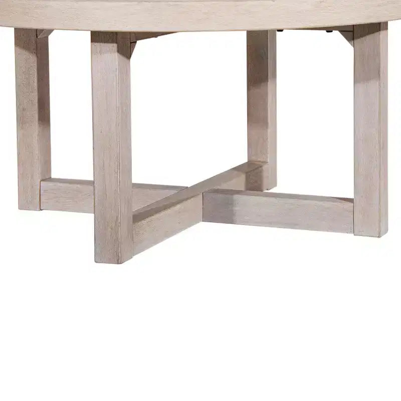 Table basse ronde East at Main 38 avec piétement entrecroisé